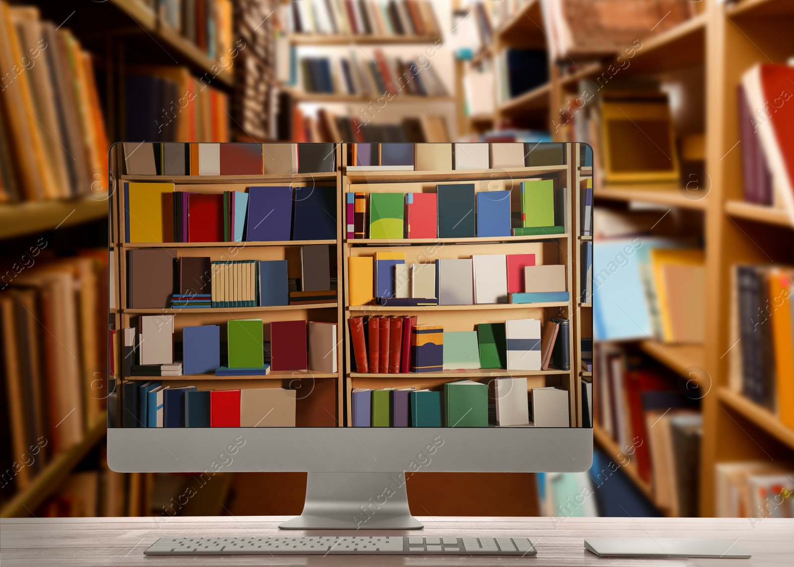 Image of Online library. Modern computer on wooden table and shelves with books indoors