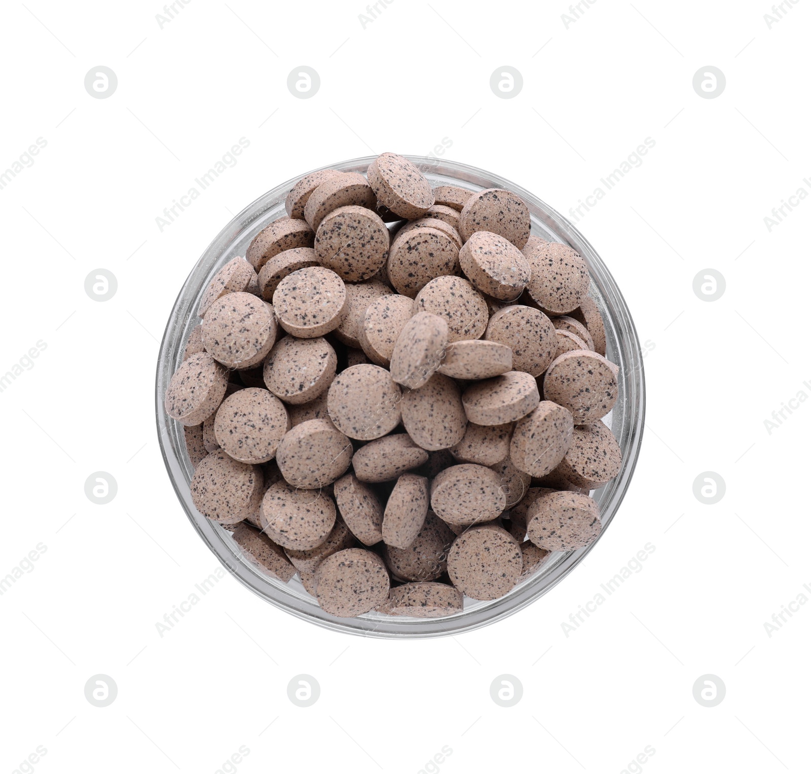Photo of Brewer's yeast tablets in bowl isolated on white, top view