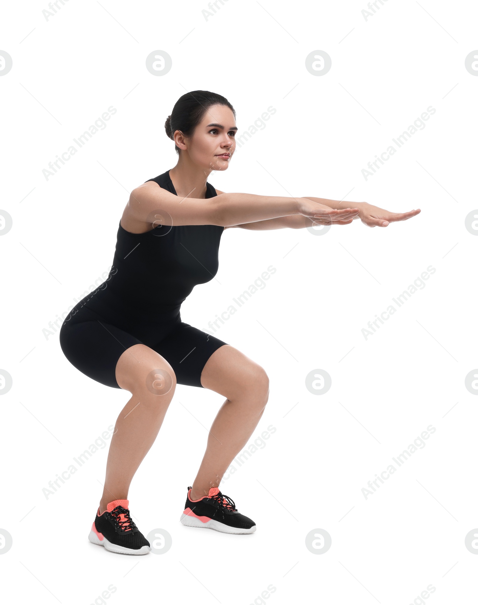 Photo of Woman doing squats on white background. Morning exercise