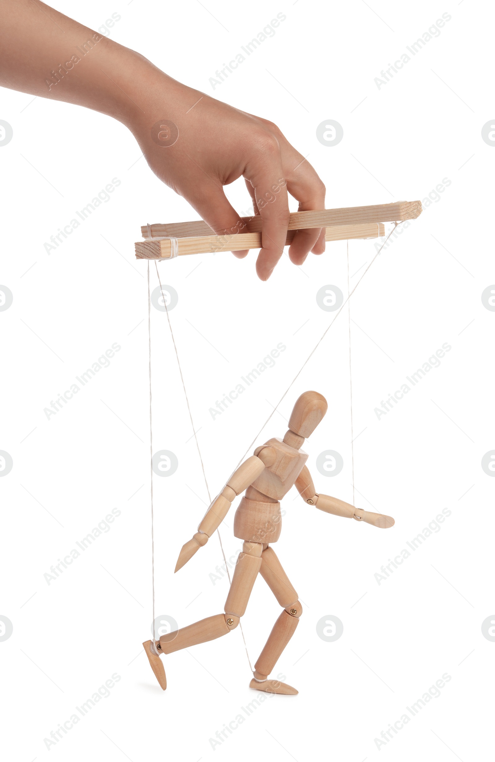 Photo of Woman pulling strings of puppet on white background, closeup