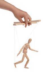 Woman pulling strings of puppet on white background, closeup