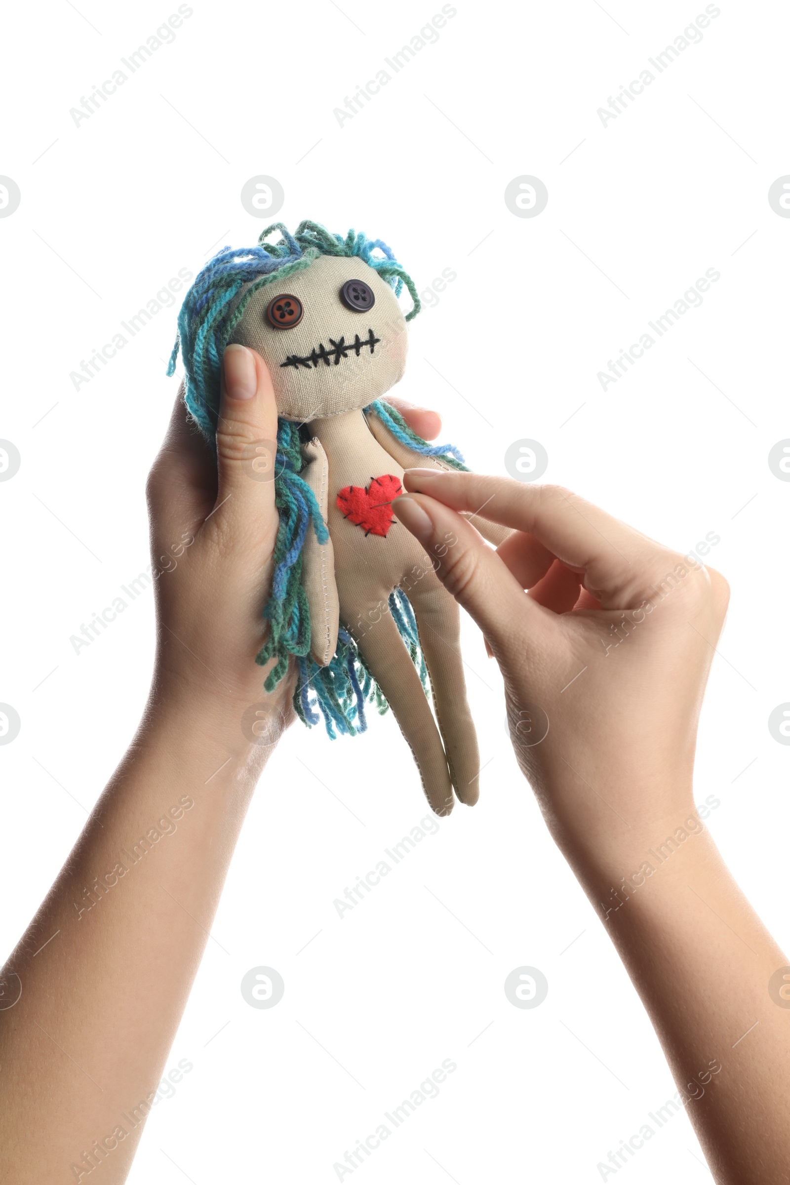 Photo of Woman stabbing voodoo doll with pin on white background, closeup