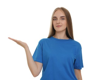Special promotion. Young woman showing something on white background
