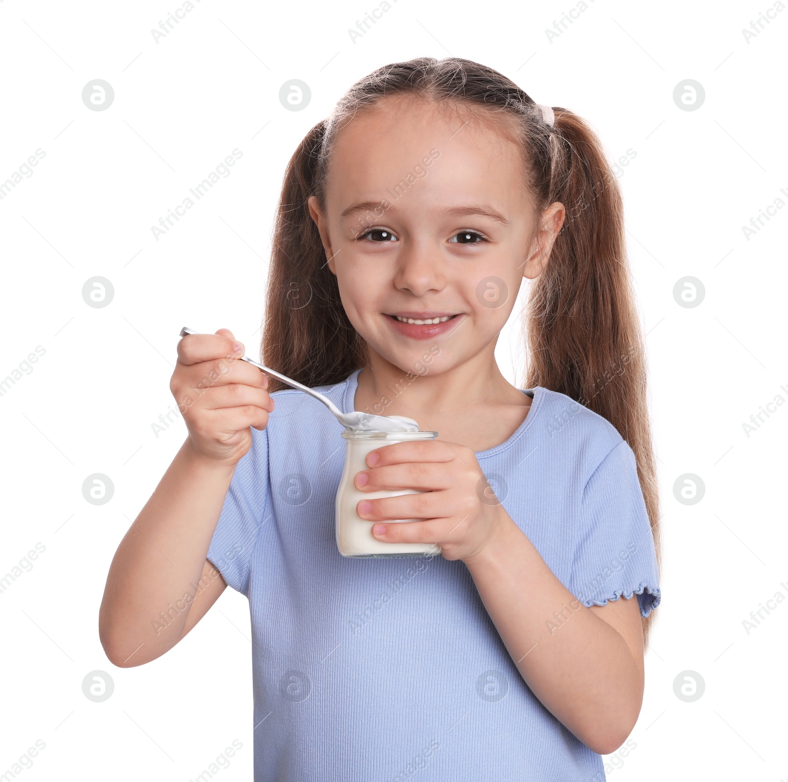 Photo of Cute little girl with tasty yogurt on white background