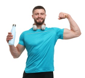Photo of Handsome man with thermo bottle and headphones on white background