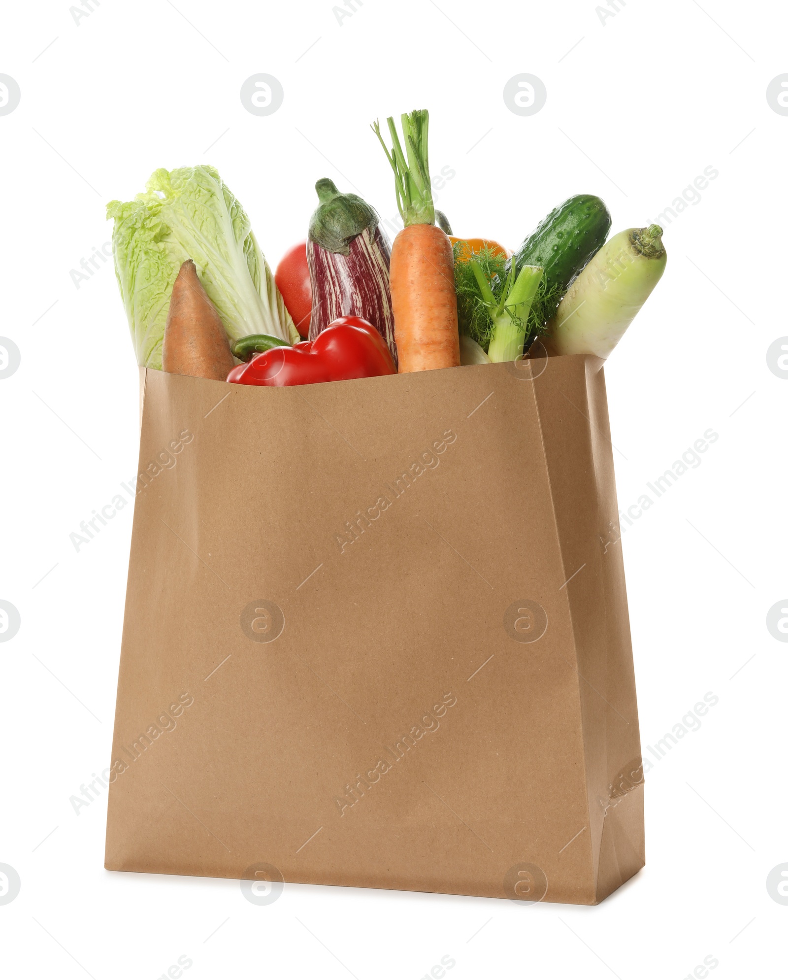 Photo of Paper bag with vegetables on white background