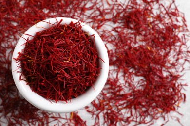 Photo of Dried saffron on table, top view. Space for text