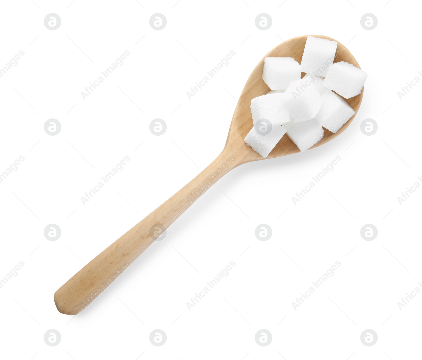 Photo of Sugar cubes in wooden spoon isolated on white, top view