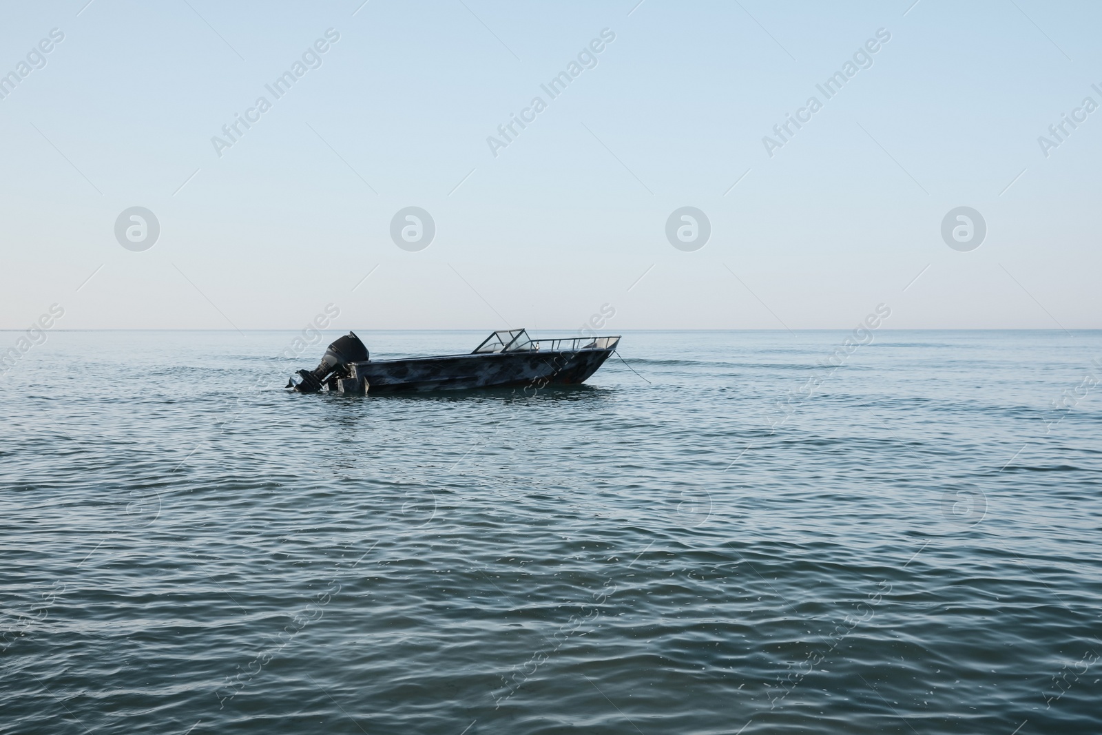 Photo of Motor boat at sea on sunny day