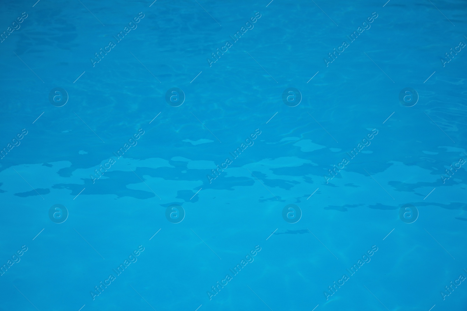 Photo of Surface of swimming pool with clean blue water as background