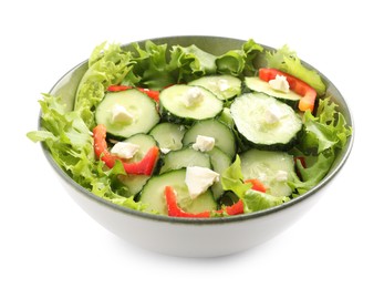 Photo of Delicious salad with cucumbers, red bell pepper and feta cheese in bowl isolated on white