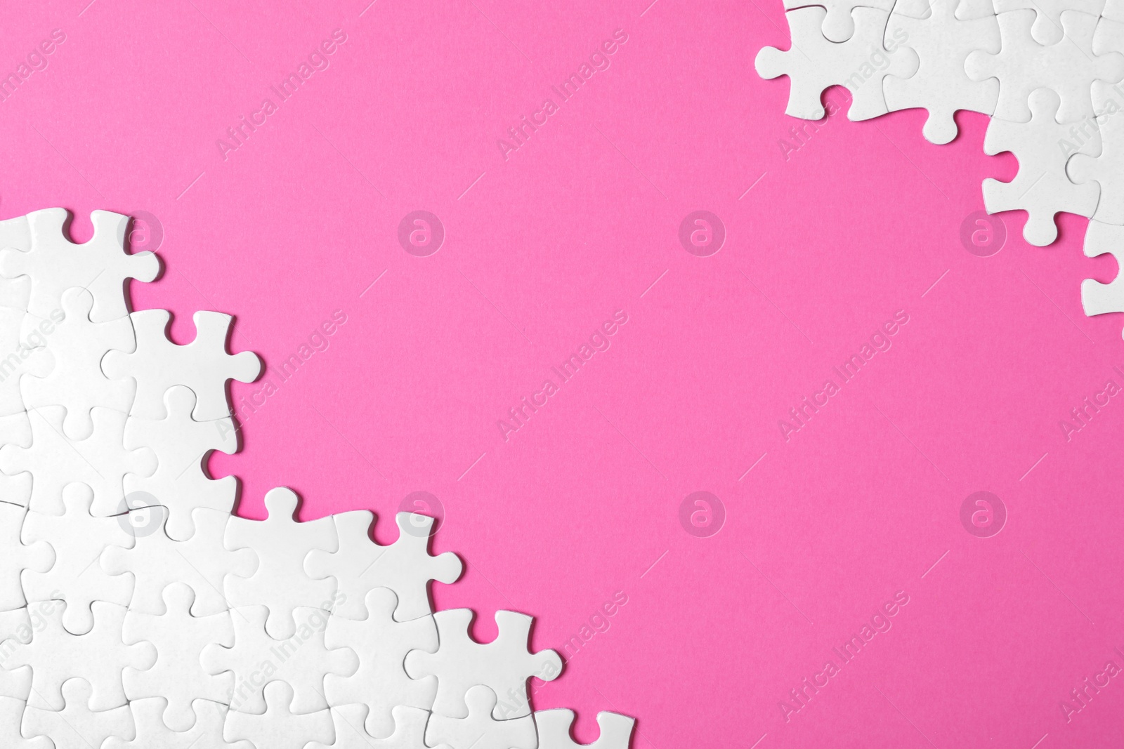 Photo of Blank white puzzle pieces on pink background, flat lay. Space for text