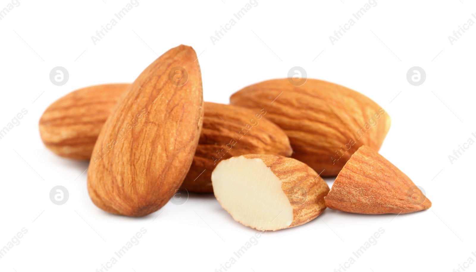 Photo of Organic almond nuts on white background, closeup. Healthy snack