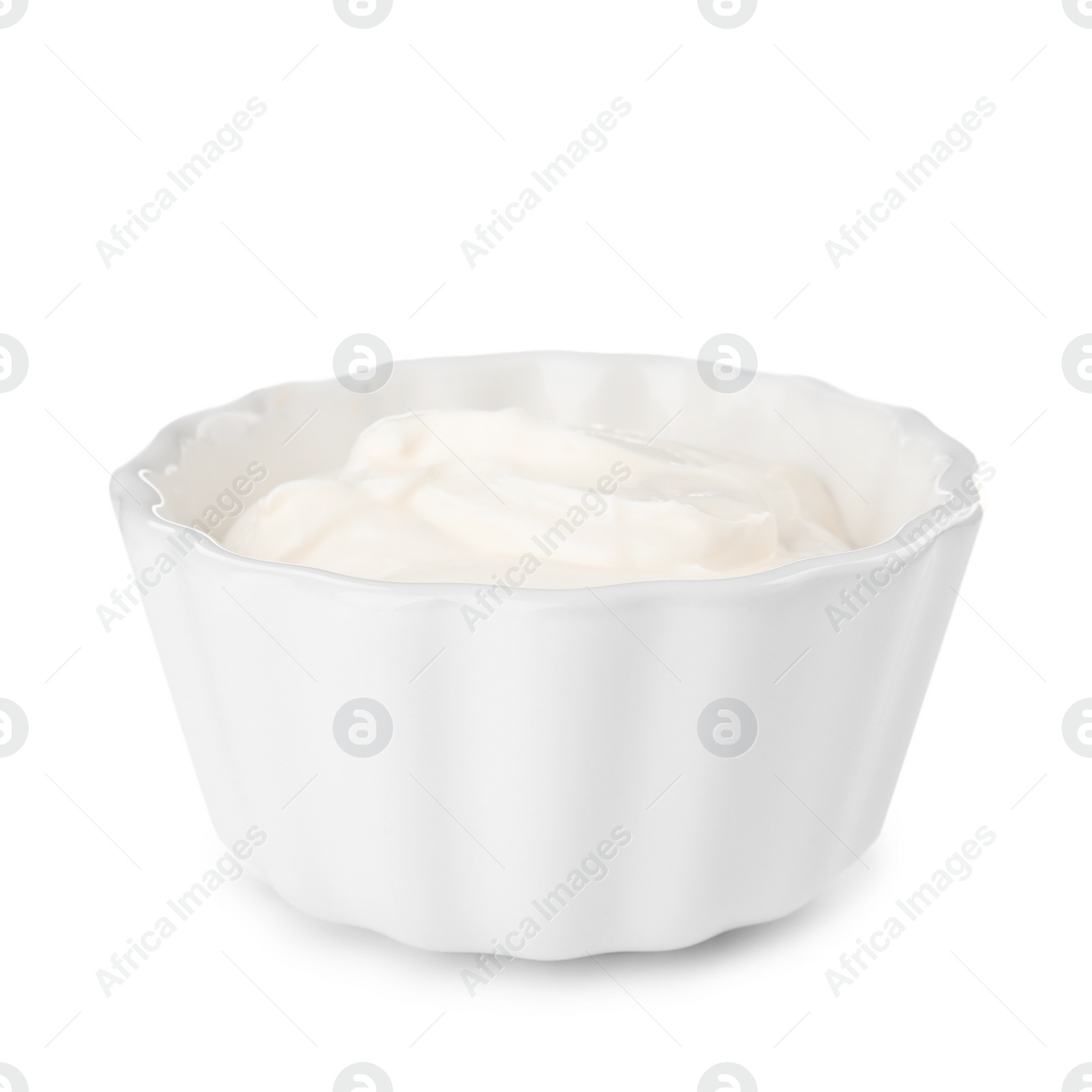 Photo of Bowl with sour cream on white background