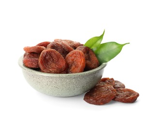 Photo of Ceramic bowl with tasty dried apricots and leaves isolated on white