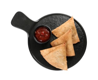 Photo of Fresh delicious crispy samosas with sauce on white background, top view