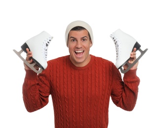 Photo of Emotional man with ice skates on white background