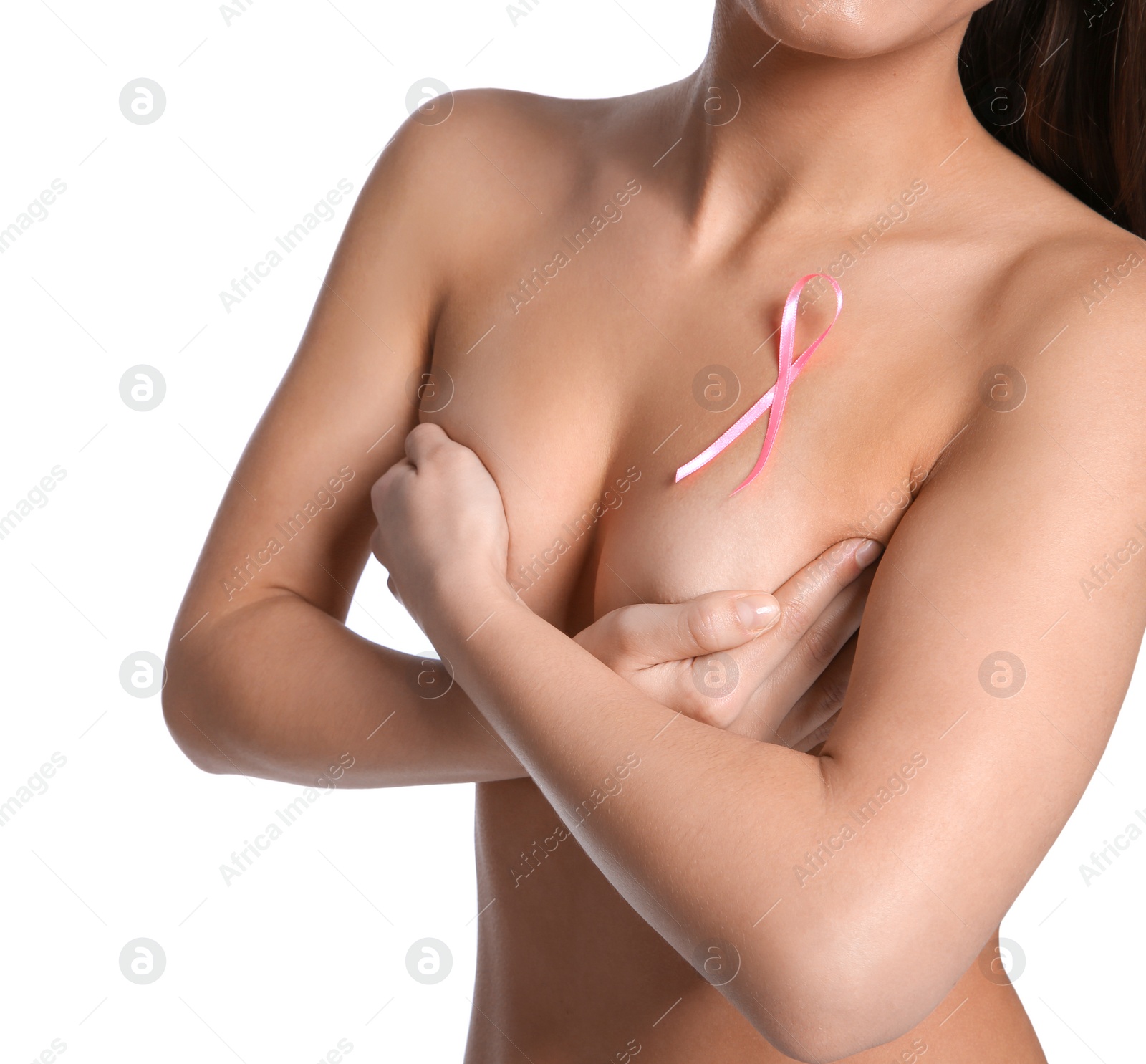 Photo of Naked woman with silk ribbon on white background, closeup. Breast cancer awareness concept