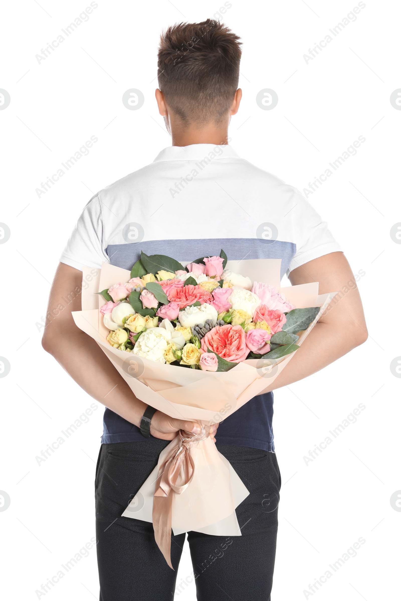 Photo of Young man holding beautiful flower bouquet on white background, back view