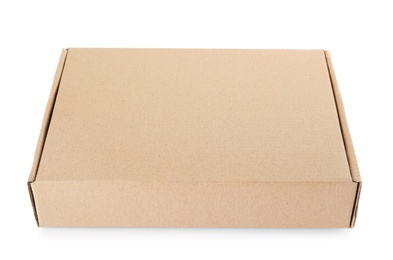 Photo of Closed cardboard box on white background. Mockup for design