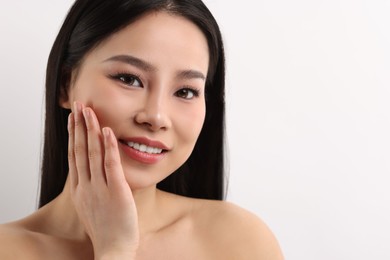 Portrait of beautiful woman on white background