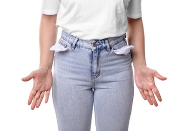 Photo of Poor woman showing empty pockets on white background, closeup