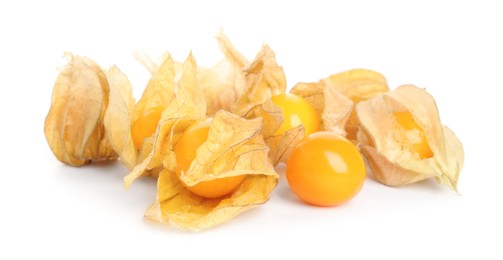 Ripe physalis fruits with dry husk on white background