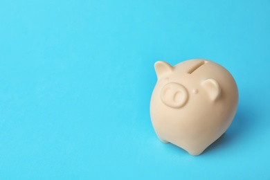 Photo of Cute piggy bank on color background. Money saving