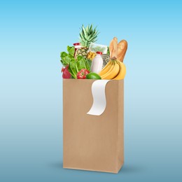 Image of Paper bag with different products and receipt on light blue background