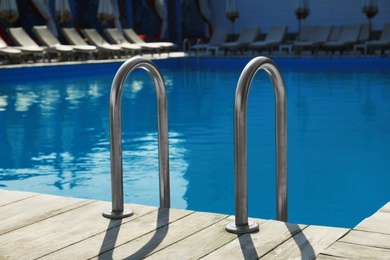 Photo of Modern swimming pool with ladder at resort