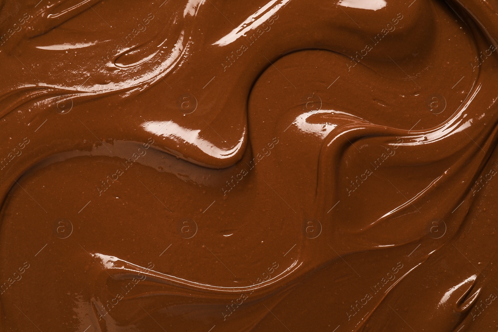 Photo of Tasty chocolate paste as background, closeup view