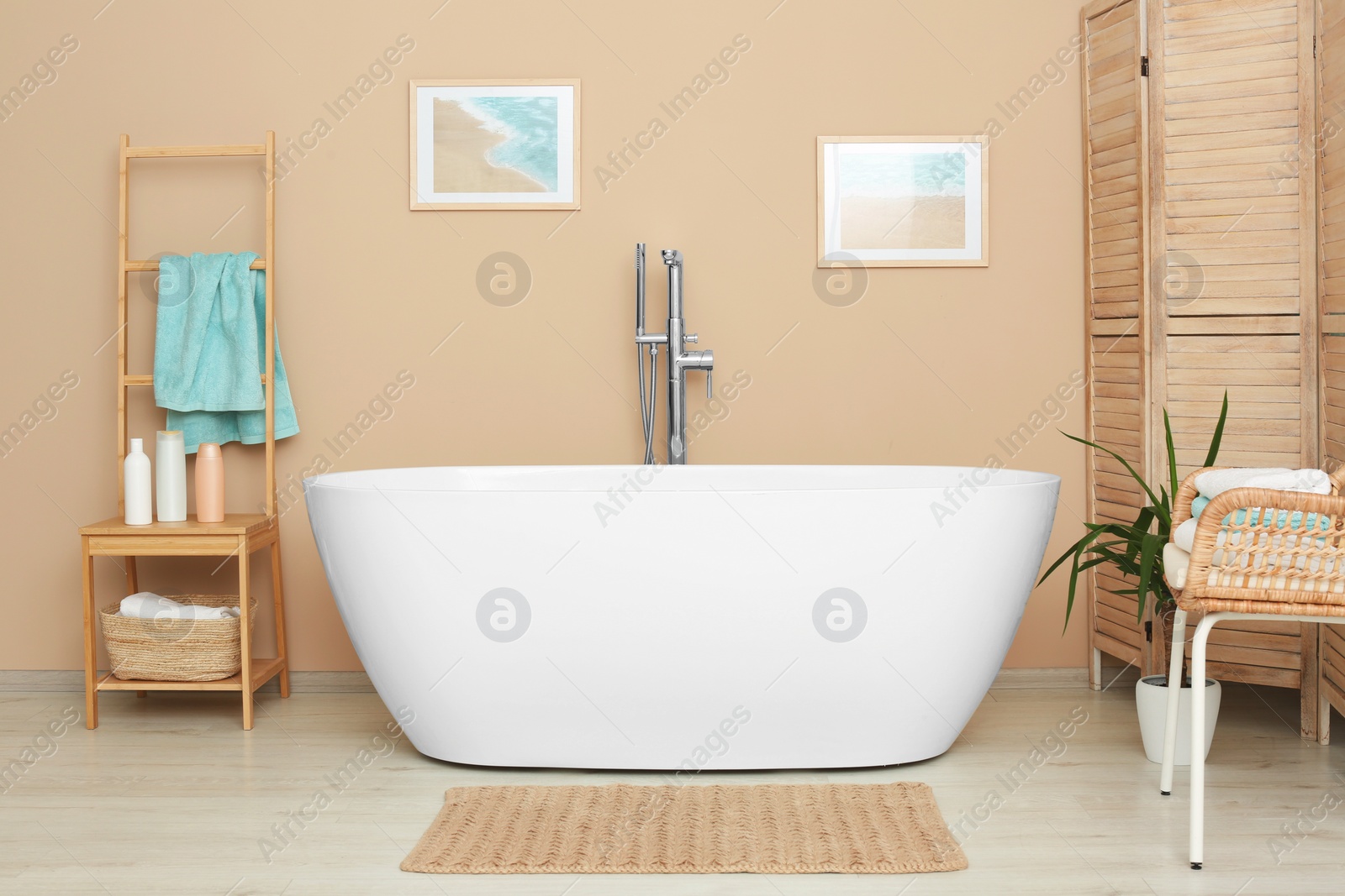 Photo of Stylish bathroom interior with white beautiful tub