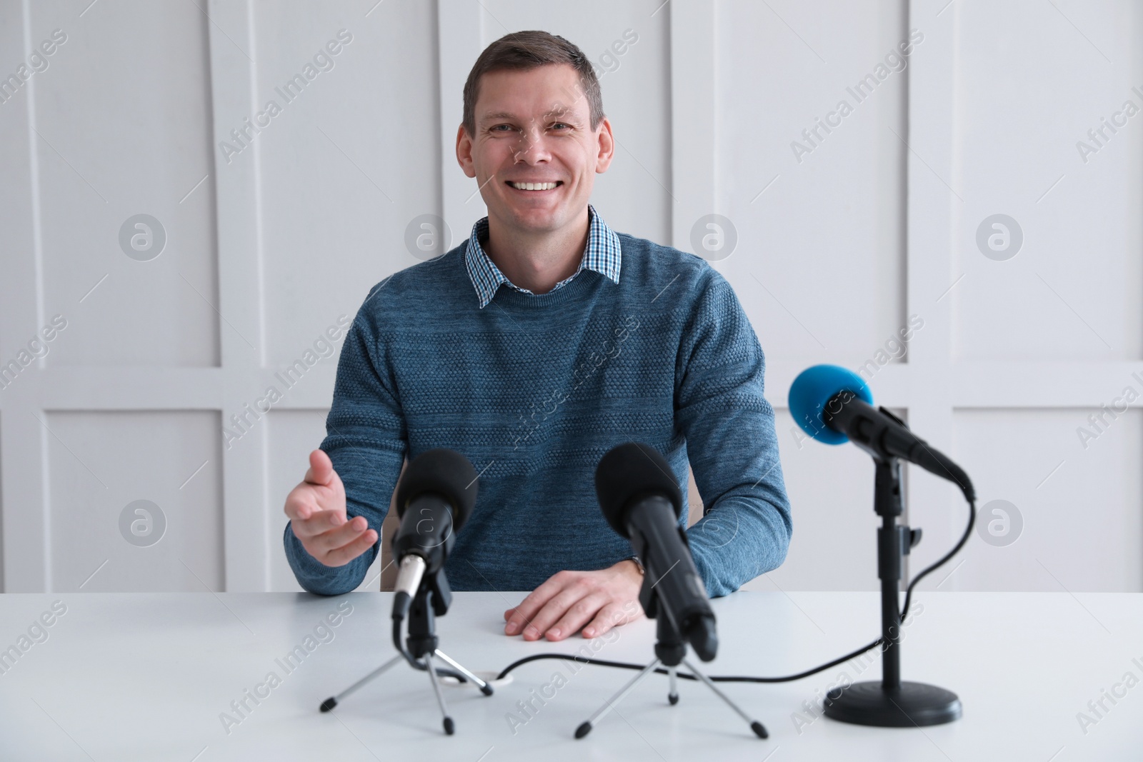 Photo of Business man giving interview at official event