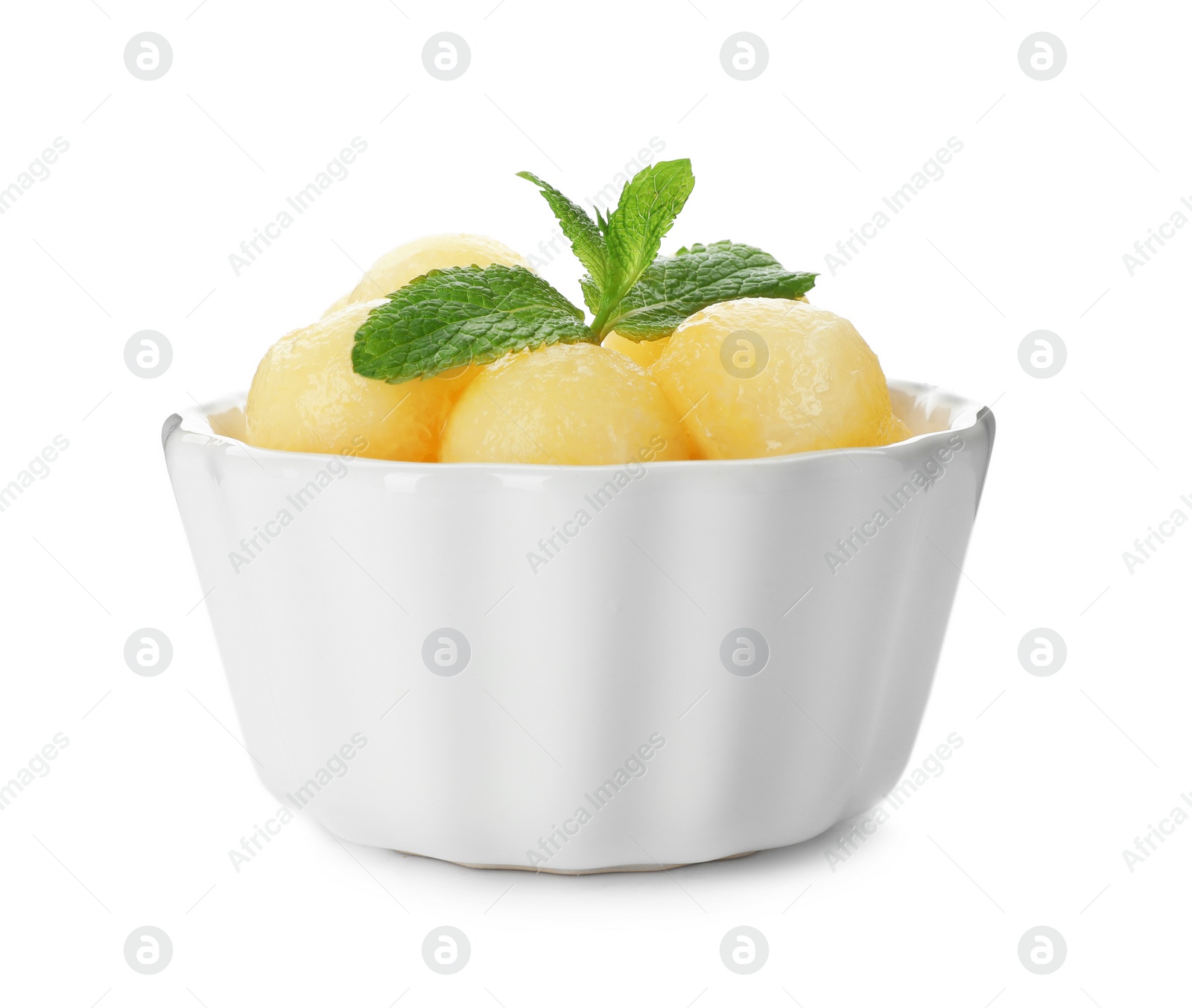 Photo of Bowl with melon balls on white background