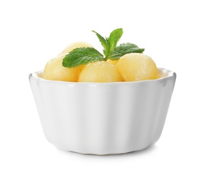 Photo of Bowl with melon balls on white background