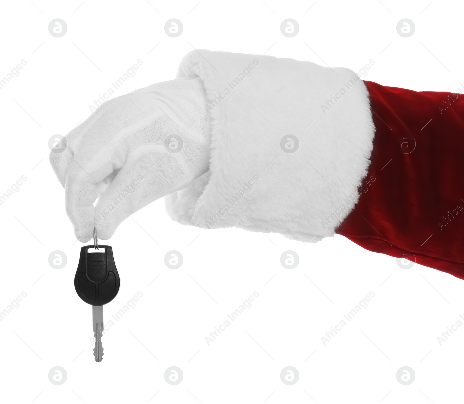 Photo of Santa Claus holding car key on white background, closeup of hand