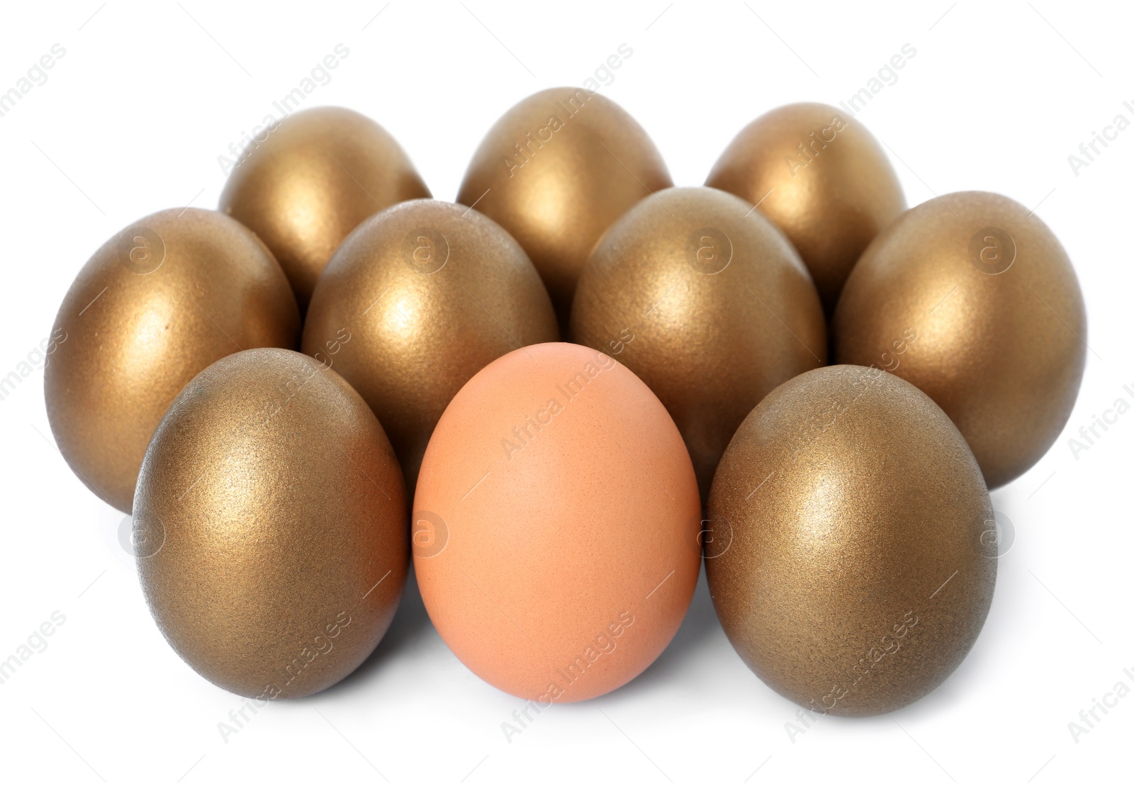 Photo of Golden eggs with different one on white background