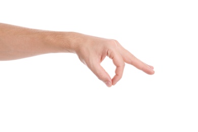 Man showing pinch gesture on white background, closeup of hand