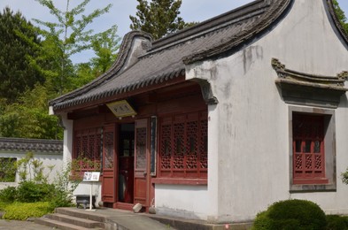 Photo of HAREN, NETHERLANDS - MAY 23, 2022: Beautiful view of oriental building in Chinese garden