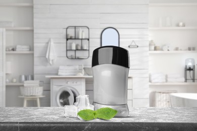 Image of Solid deodorant, mint and ice cubes on grey table in bathroom. Mockup for design