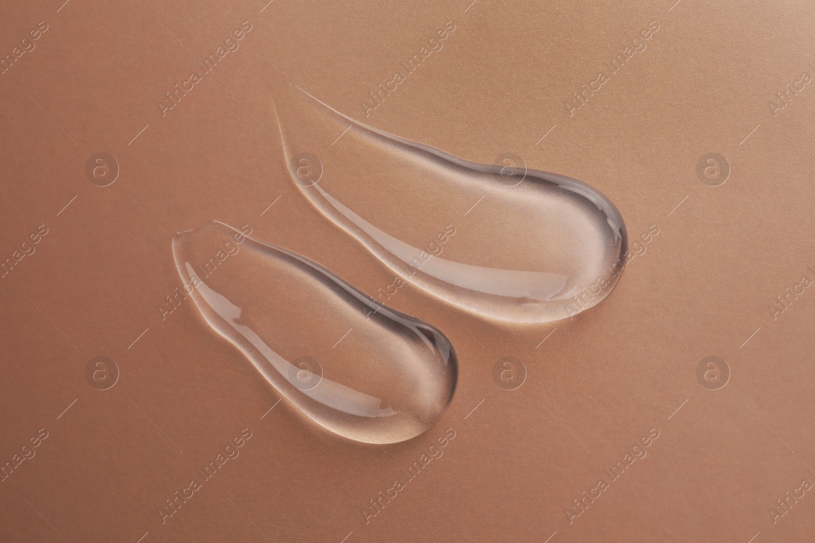 Photo of Sample of transparent gel on color background, top view