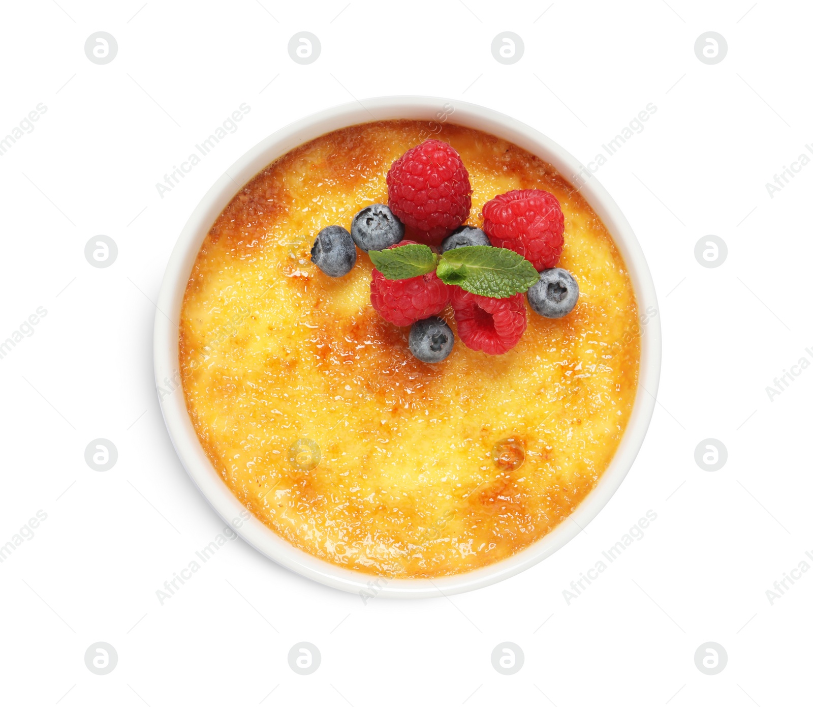 Photo of Delicious creme brulee with fresh berries isolated on white, top view