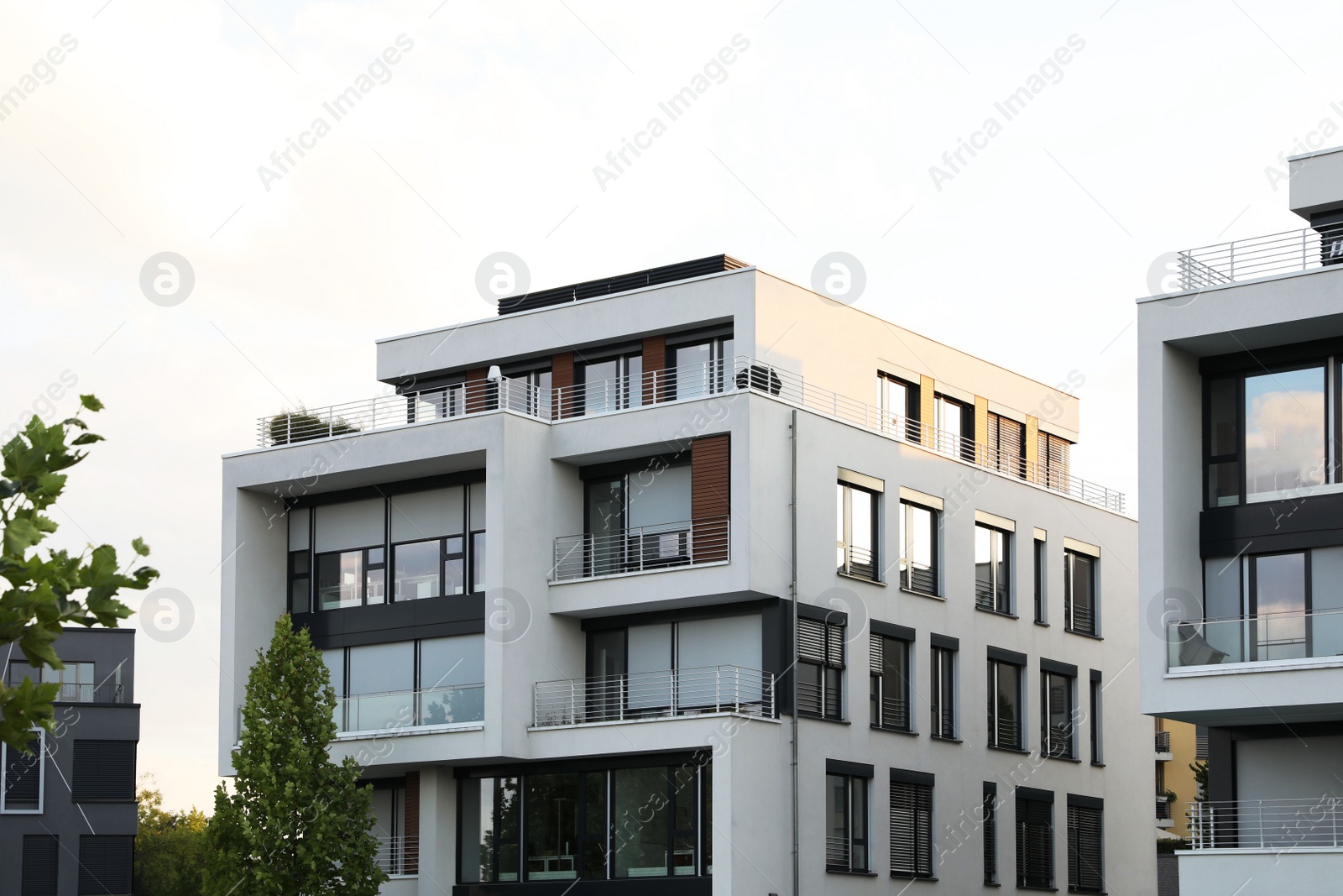 Photo of Beautiful view of modern buildings with big windows outdoors