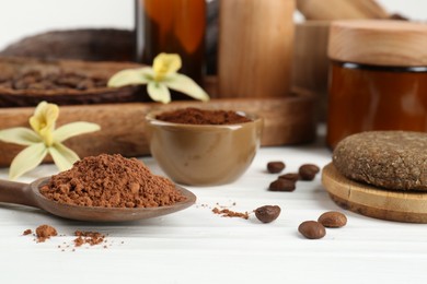 Homemade cosmetic products and fresh ingredients on white wooden table, closeup