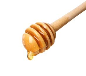 Photo of Honey dripping from dipper on white background