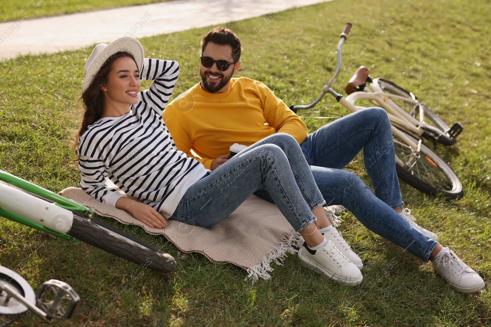 Photo of Beautiful young couple spending time together outdoors