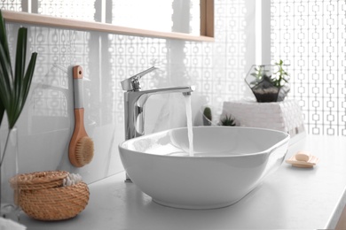 Photo of Stylish white sink in modern bathroom interior