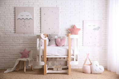 Photo of Baby room interior with toys and stylish furniture