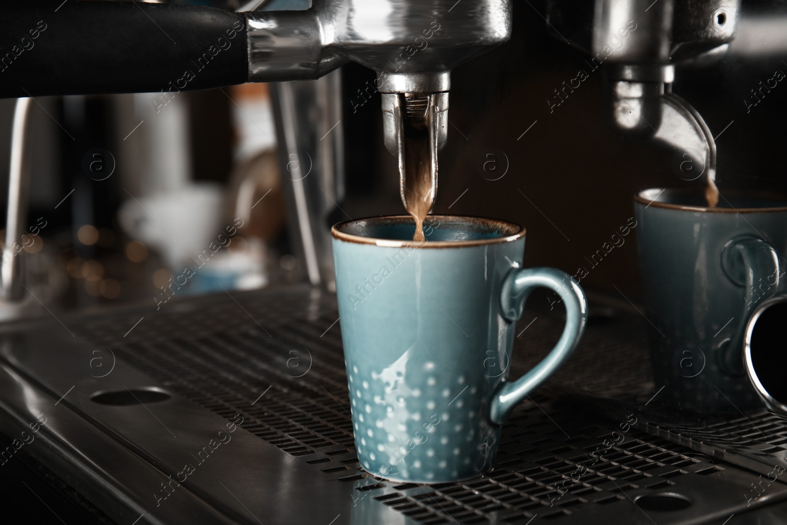 Photo of Making fresh aromatic espresso using professional coffee machine