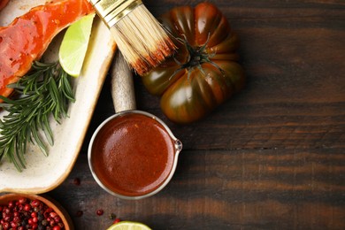 Photo of Fresh marinade, fish and other products on wooden table, flat lay. Space for text